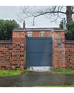 Emerald aluminium side gate 2000x1000mm in Anthracite Grey with red brick house and fence either side