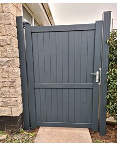 Emerald aluminium pedestrian gate in anthracite grey with silver metal handle outside house